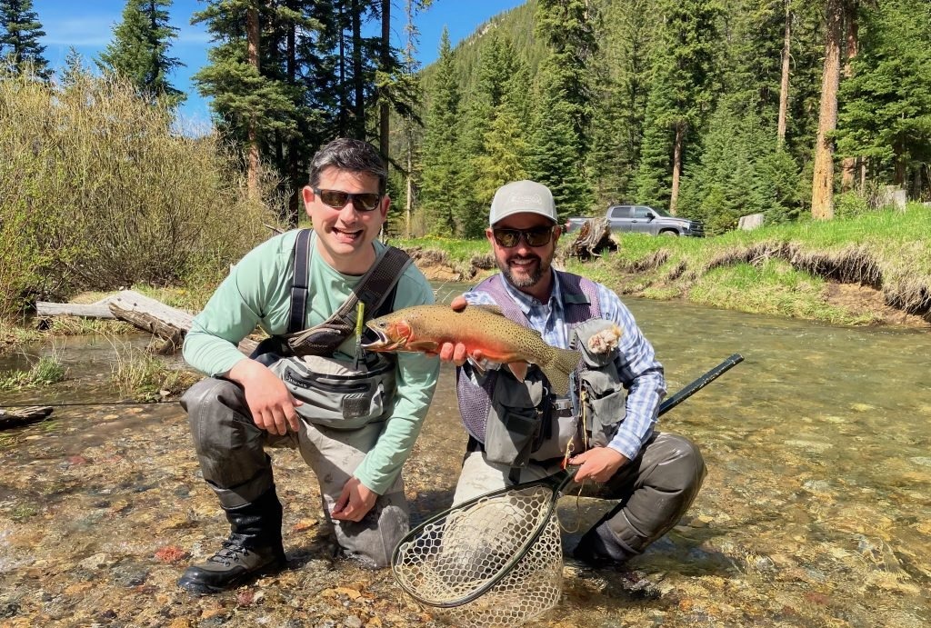 6:20 PMClaude responded: Missoula fly fishing guide James Quigley with a client holding a cutthroat trout on a guided fly fishing trip in Missoula, MontanaMissoula fly fishing guide James Quigley with a client holding a cutthroat trout on a guided fly fishing trip in Missoula, Montana